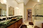 Master Bath with dual vanity, large closet, shower, and jetted soaking tub.